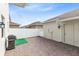 Private brick paver patio surrounded by white fences and access doors, great for outdoor activities and grilling at 3099 Ella Way, St Cloud, FL 34771