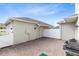 Private brick paver patio surrounded by white fences and access doors, great for outdoor activities and grilling at 3099 Ella Way, St Cloud, FL 34771