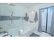 Bright bathroom with tub, shower, and access to an outdoor privacy enclosure at 3160 Whisper Wind Dr, St Cloud, FL 34771