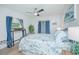 Bright bedroom with large window, desk, and light and airy decor at 3160 Whisper Wind Dr, St Cloud, FL 34771