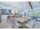 Open-concept dining area adjacent to a modern kitchen, perfect for entertaining and Gathering gatherings at 3160 Whisper Wind Dr, St Cloud, FL 34771