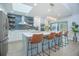 Spacious kitchen featuring a large island with bar seating, stainless appliances, and ample storage at 3160 Whisper Wind Dr, St Cloud, FL 34771