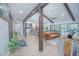 Open-concept living room seamlessly connects to the kitchen, offering views of the lanai and pool at 3160 Whisper Wind Dr, St Cloud, FL 34771