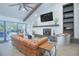 Inviting living room featuring a fireplace, stylish decor, and ample seating at 3160 Whisper Wind Dr, St Cloud, FL 34771
