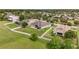 Aerial view of a home featuring a spacious backyard with a pergola, surrounded by a white fence and green landscape at 31980 Geoff Way, Sorrento, FL 32776