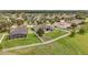 Spacious backyard features a fenced yard, open patio, and pool with screen enclosure at 31980 Geoff Way, Sorrento, FL 32776