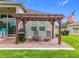 Backyard patio with grill and pergola, ideal for outdoor entertaining at 31980 Geoff Way, Sorrento, FL 32776