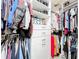 Custom designed closet with multiple rows of clothing and built-in shelving and drawers at 31980 Geoff Way, Sorrento, FL 32776