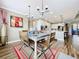 Open concept features a dining area that flows into the kitchen with ample counter space at 31980 Geoff Way, Sorrento, FL 32776