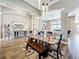 Inviting dining area with modern lighting, arched doorways, and views to the living room at 31980 Geoff Way, Sorrento, FL 32776