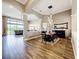 Open-concept dining room with stylish light fixture and seamless transition to living area at 31980 Geoff Way, Sorrento, FL 32776