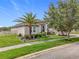 Charming single-story home with manicured lawn, lush landscaping and brick paved driveway at 31980 Geoff Way, Sorrento, FL 32776