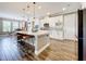 Spacious kitchen features a large island with seating, stainless steel appliances, and white cabinetry at 31980 Geoff Way, Sorrento, FL 32776
