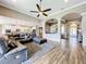 Spacious living room boasts an open floor plan with seamless flow to the kitchen at 31980 Geoff Way, Sorrento, FL 32776