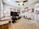 Bright office space featuring desks, wall decor, overhead lighting, and carpet flooring at 31980 Geoff Way, Sorrento, FL 32776