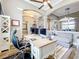 Spacious office with coffered ceilings, modern desk, and comfortable seating area at 31980 Geoff Way, Sorrento, FL 32776