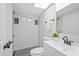 Modern bathroom featuring black and white subway tiles, and a shower at 370 Hand Ave, Ormond Beach, FL 32174