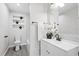 Modern bathroom featuring a sleek vanity, contemporary fixtures, and stylish tiled accents at 370 Hand Ave, Ormond Beach, FL 32174