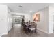 Open dining area with modern floors, neutral walls, and seamless flow to kitchen at 370 Hand Ave, Ormond Beach, FL 32174
