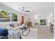 Open-concept living room filled with natural light, stylish decor, and modern finishes at 370 Hand Ave, Ormond Beach, FL 32174