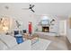 Cozy living room features a fireplace, comfortable seating, and elegant decor for relaxation and entertainment at 370 Hand Ave, Ormond Beach, FL 32174
