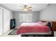 Bright bedroom with ceiling fan, natural light, neutral walls and modern decor at 3702 Starks St, Orlando, FL 32805