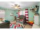 Colorful bedroom featuring a crib, toys, and kid-friendly decor at 3702 Starks St, Orlando, FL 32805