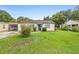 Charming single-story home with a well-maintained front yard at 3702 Starks St, Orlando, FL 32805