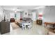 Inviting living room featuring a comfortable gray sofa, modern décor, and ample natural light at 3702 Starks St, Orlando, FL 32805