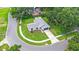 Aerial view of a home with a grey roof, a manicured lawn, and mature trees at 400 Timbercreek N Dr, Winter Garden, FL 34787