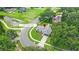 Aerial view of home showing landscaping, golf cart access, and nearby lake at 400 Timbercreek N Dr, Winter Garden, FL 34787