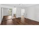 Bedroom with sliding closet doors, wood floors, and neutral walls at 400 Timbercreek N Dr, Winter Garden, FL 34787