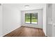 Bright bedroom with a window overlooking the front yard and hard wood floors at 400 Timbercreek N Dr, Winter Garden, FL 34787