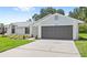 Charming single-story home featuring a well-maintained lawn and a two-car garage at 400 Timbercreek N Dr, Winter Garden, FL 34787