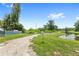 Golf cart path by a pond and trees, offering outdoor recreation access at 400 Timbercreek N Dr, Winter Garden, FL 34787
