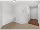Entryway featuring neutral tile floor and leading to a bright white hallway with wood-look floors at 400 Timbercreek N Dr, Winter Garden, FL 34787