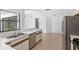 Bright kitchen with stainless steel appliances, tile flooring, and plenty of counter space at 400 Timbercreek N Dr, Winter Garden, FL 34787