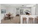 Cozy eat-in kitchen features stainless steel appliances, breakfast bar, and adjoining dining area at 400 Timbercreek N Dr, Winter Garden, FL 34787
