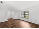 Open living room with hard wood flooring, white walls, a large window allowing for natural light at 400 Timbercreek N Dr, Winter Garden, FL 34787