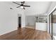Bright living room featuring wood floors and an eat-in kitchen at 400 Timbercreek N Dr, Winter Garden, FL 34787