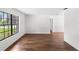 Spacious living room featuring wood-look floors and a window that let in natural light at 400 Timbercreek N Dr, Winter Garden, FL 34787