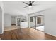 Open-concept living room featuring wood floors and sliding doors to an outdoor patio at 400 Timbercreek N Dr, Winter Garden, FL 34787