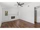 Bright living room with fireplace, hardwood floors, and view to the backyard at 400 Timbercreek N Dr, Winter Garden, FL 34787