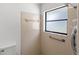 Shower featuring tiled walls, a window, and a shower head at 400 Timbercreek N Dr, Winter Garden, FL 34787