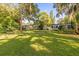 Expansive backyard with a lush lawn offering endless possibilities for outdoor activities and relaxation at 414 W 19Th St, Sanford, FL 32771