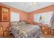 Cozy bedroom with plenty of natural light and large bed at 414 W 19Th St, Sanford, FL 32771