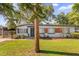 Charming single-story home featuring mature landscaping and a well-maintained front yard at 414 W 19Th St, Sanford, FL 32771