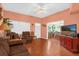 Inviting living room with hardwood floors, comfortable seating, and open access to the dining area at 414 W 19Th St, Sanford, FL 32771