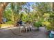 Relax and unwind on the spacious outdoor patio surrounded by mature trees, perfect for enjoying the Florida sunshine at 414 W 19Th St, Sanford, FL 32771
