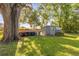 A spacious storage shed in a large backyard, providing ample space for tools and equipment at 414 W 19Th St, Sanford, FL 32771
